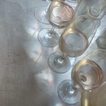 Wine Glasses on Bench Reflecting Flag from above